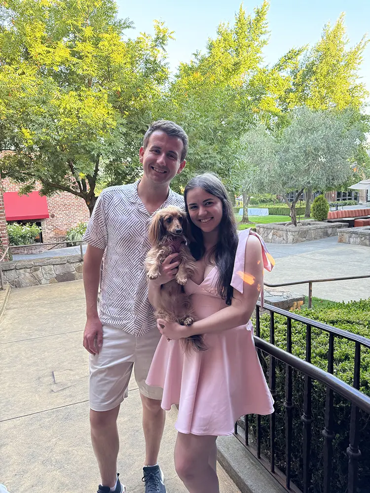 The founders of My Dog Calendar with their miniature long-haired dachshund, Minnie